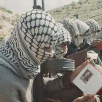 Palestinian guerrilla fighters in Jordan studying Quotations from Chairman Mao Zedong, 1970